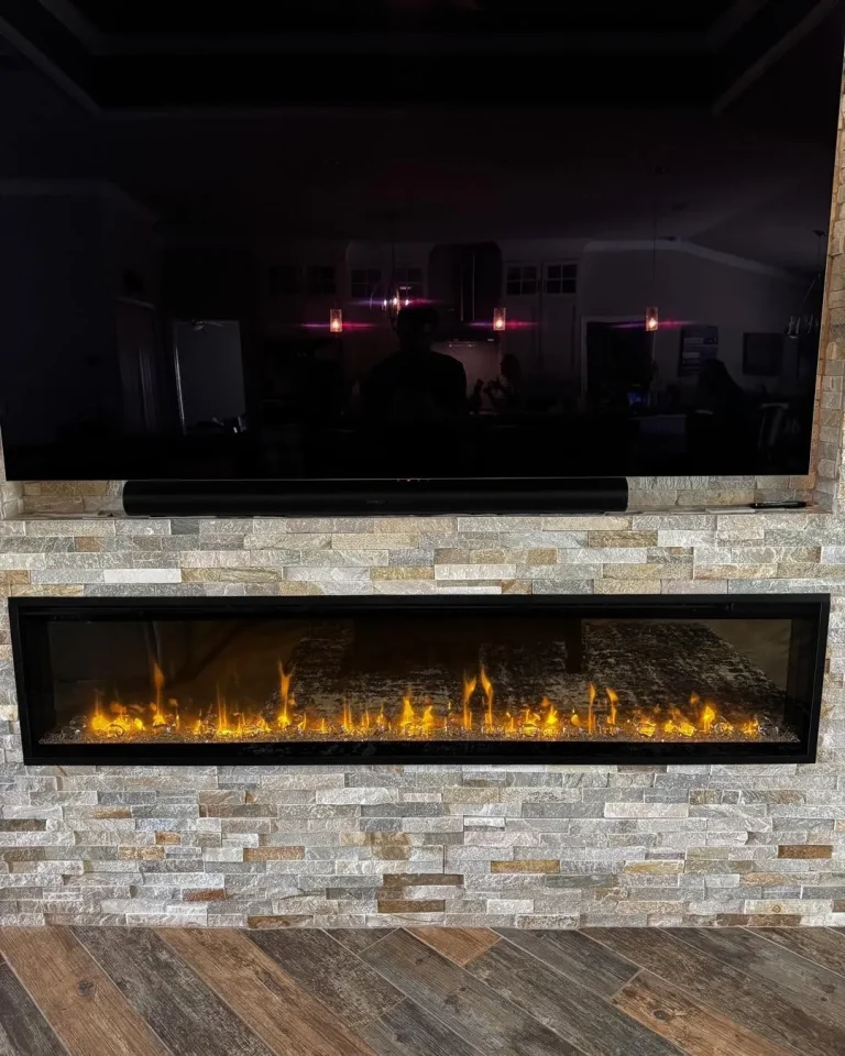 74 inch Dimplex Ignite XL electric fireplace in a stacked stone wall