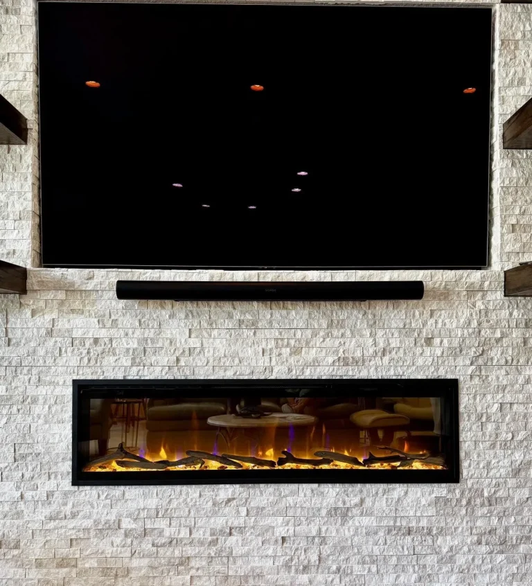 Dimplex Evolve linear electric fireplace in a white stacked stone wall