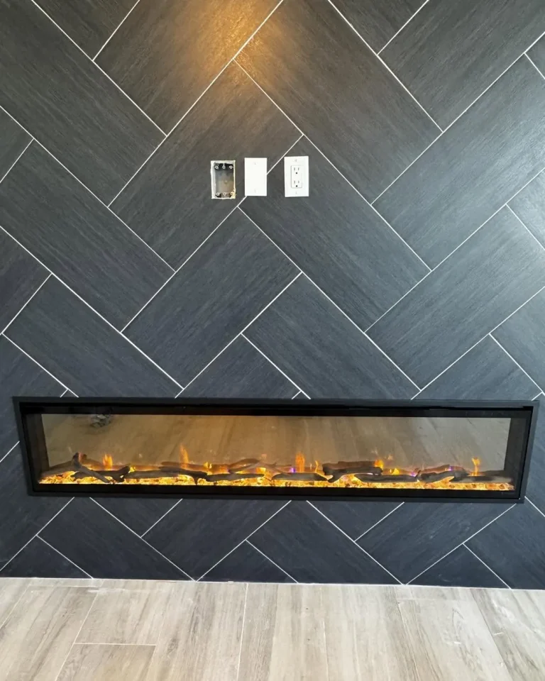 Dimplex Evolve linear electric fireplace in a herringbone tile wall
