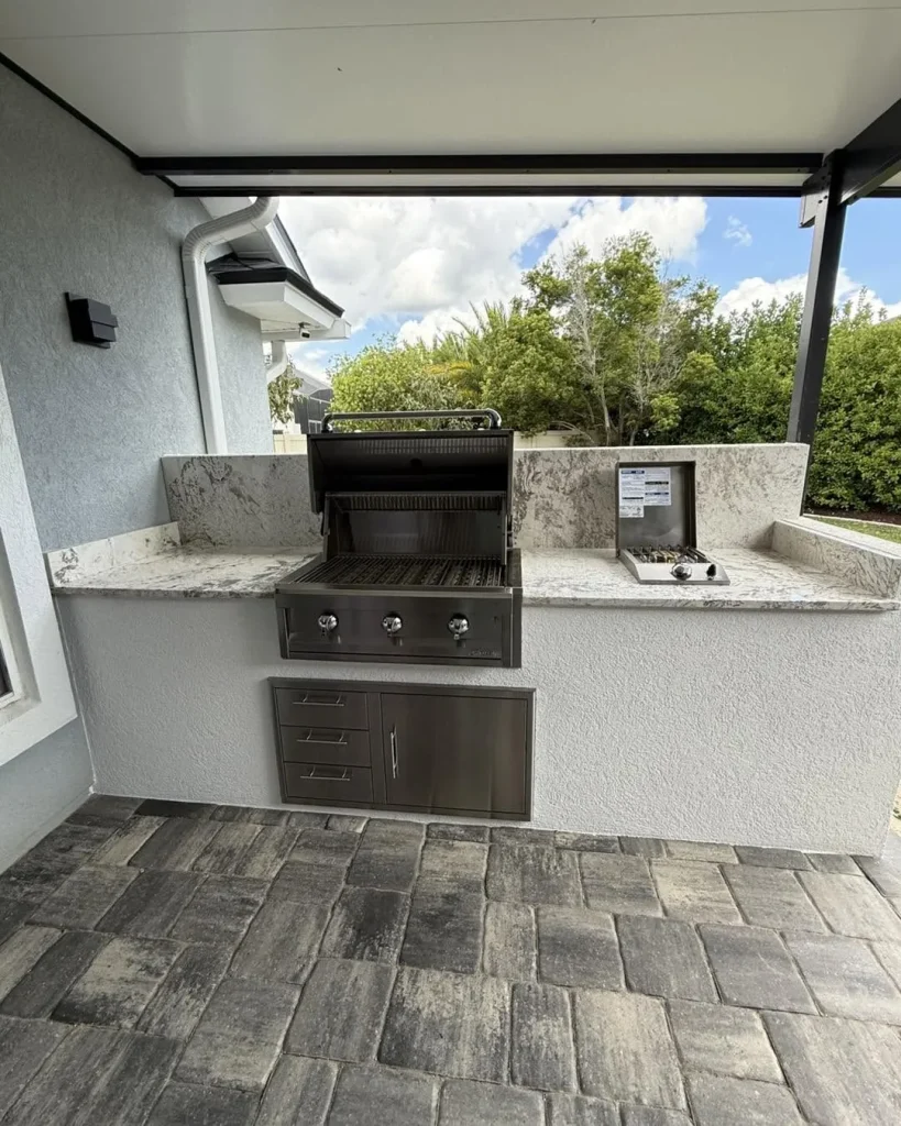 Summer kitchen with granite counters, built-in grill and side burner