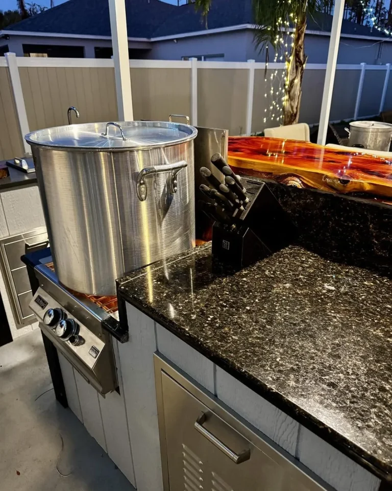 Power burner with a seafood boil pot in an outdoor kitchen