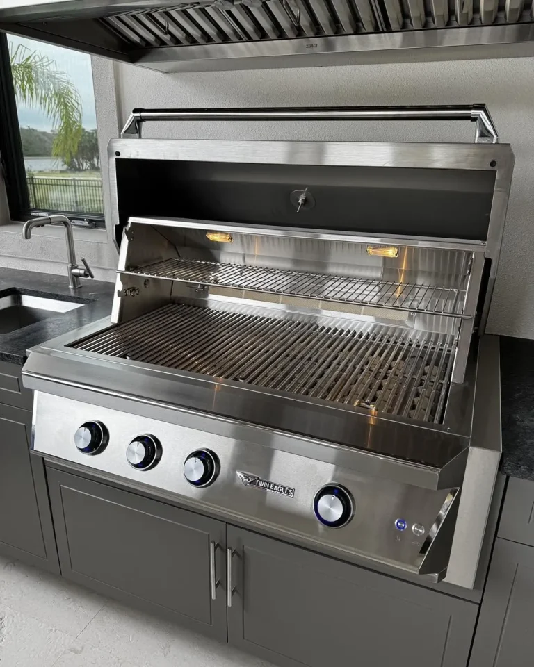 Twin Eagles built-in grill in a gray outdoor kitchen