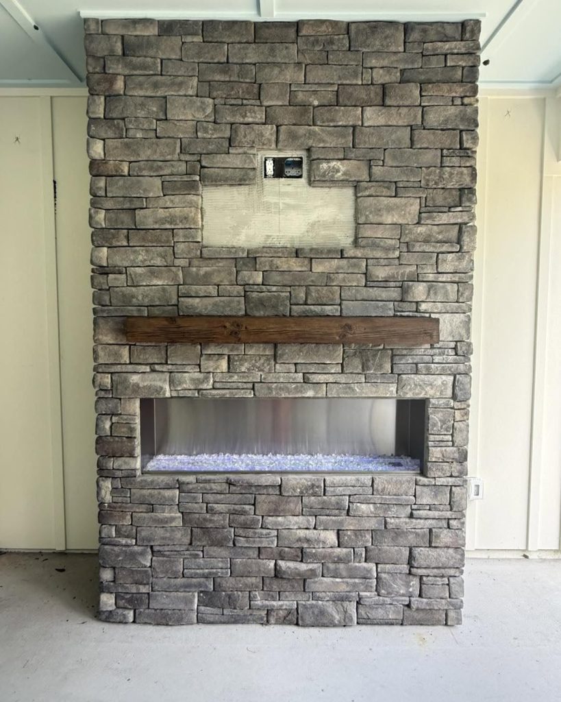 Outdoor linear gas fireplace installed in a new construction home lanai